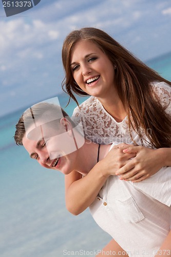 Image of smiling young couple having fun in summer holiday