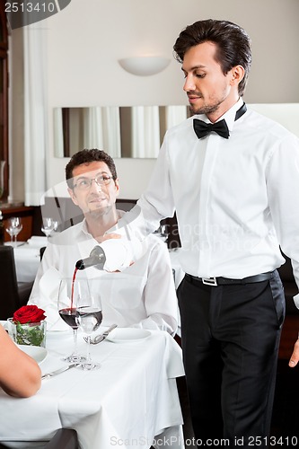 Image of man and woman for dinner in restaurant