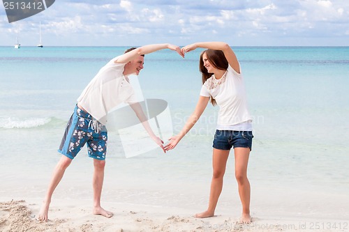 Image of smiling young couple having fun in summer holiday