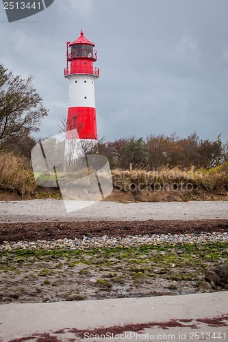 Image of landscape baltic sea dunes lighthouse in red and white 