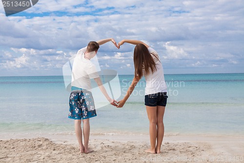Image of smiling young couple having fun in summer holiday