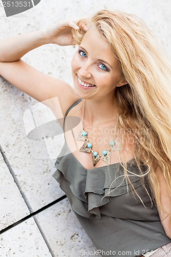 Image of happy young blonde woman with hat outdoor summertime