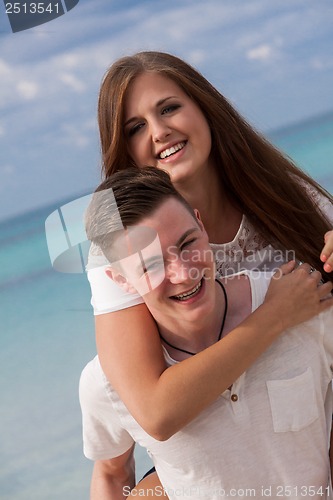 Image of smiling young couple having fun in summer holiday