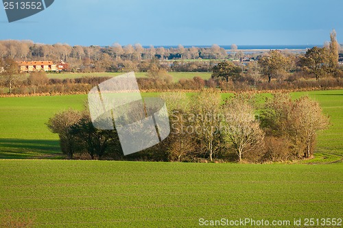 Image of beautiful landscape of green farmland and blue sky