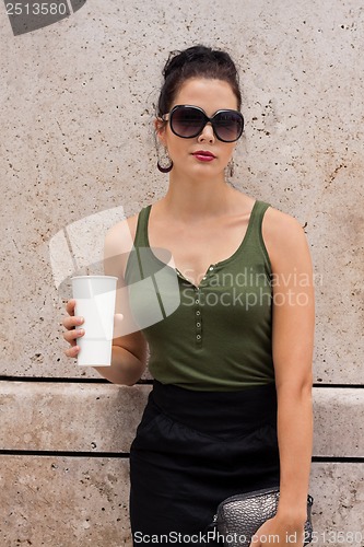 Image of attractive young woman with  sunglasses outdoor