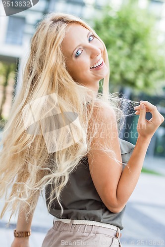 Image of happy young blonde woman with hat outdoor summertime