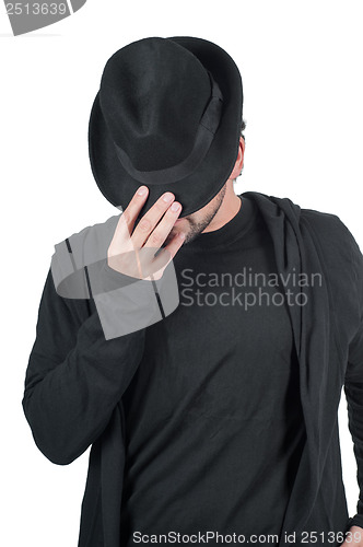 Image of Man covers his face with his hat