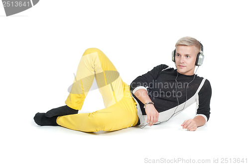 Image of Man in headphones lying watching on you