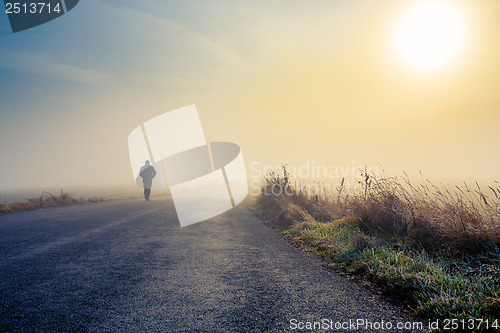 Image of men silhouette in the fog