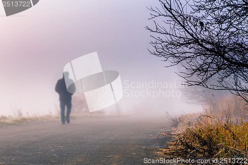 Image of men silhouette in the fog