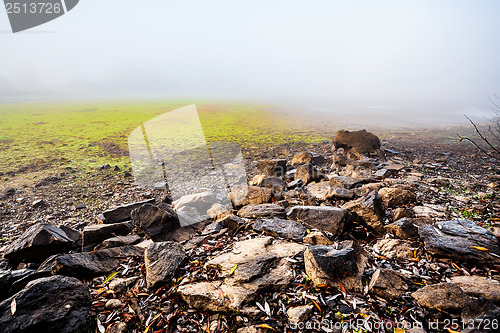 Image of The cool autumn morning at the pond drained 