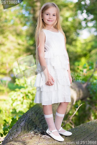 Image of Little girl in white dress