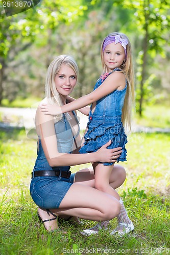 Image of Blond woman with girl