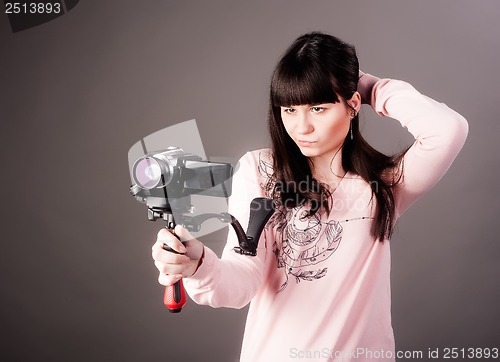 Image of young woman with video camera