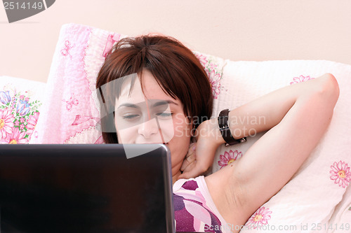 Image of Young woman with laptop 