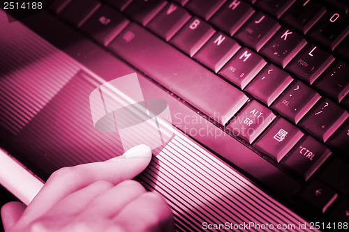 Image of Working at laptop .
