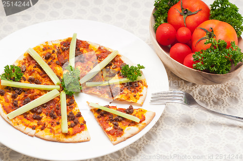 Image of Turkish beef pizza with cucumber on top