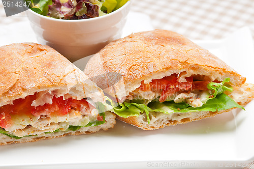 Image of ciabatta panini sandwich with chicken and tomato