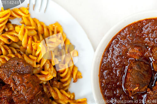 Image of fusilli pasta with neapolitan style ragu meat sauce