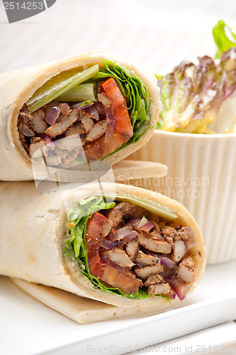 Image of kafta shawarma chicken pita wrap roll sandwich