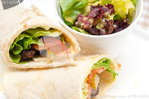 Image of kafta shawarma chicken pita wrap roll sandwich