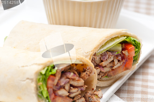 Image of kafta shawarma chicken pita wrap roll sandwich