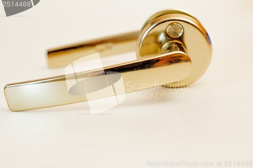 Image of Nickel-plated door handle on a white background.