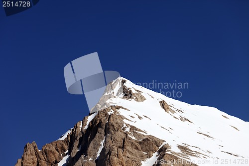 Image of Mountain top with snow and cloudless blue sky in nice day