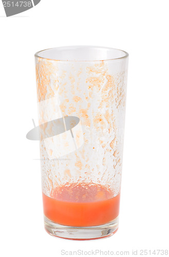 Image of Half full tomato juice glass isolated on white background 