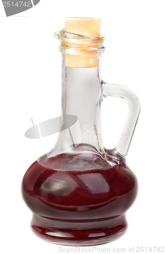 Image of Small decanter with red wine vinegar isolated on the white 