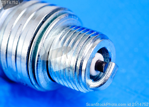 Image of spark-plug  on the  blue  background