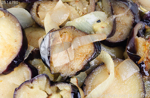 Image of sliced and fried eggplants and onion as  background 