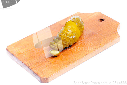 Image of cucumber sliced on cutting board   isolated on white 
