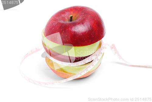 Image of Healthy eating and diet concept:Green and red sliced apple with tape on white background 