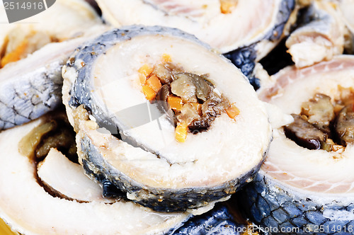 Image of korean rolls on slices of salt  herring  