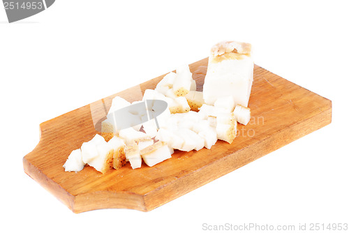 Image of Sliced pig lard on cutting  board isolated on  white 