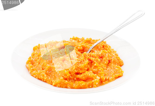 Image of porridge pumpkin and steel spoon 