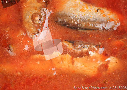 Image of  fish in tomato sauce as food background 