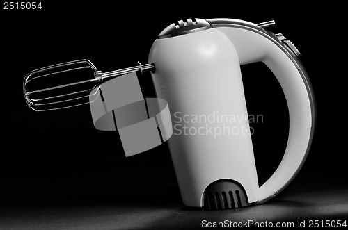 Image of electric mixer isolated on black