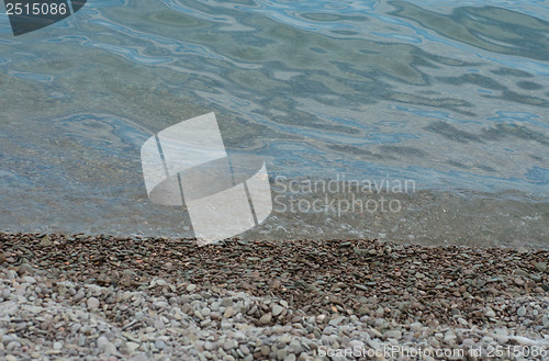 Image of Stony shore in daylight  with sea  wave 