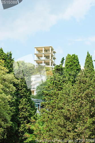 Image of New apartments building over  blue sky  and  green  tree.Crimea. Ukraine.