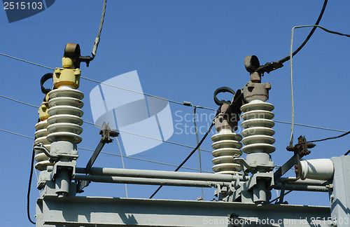 Image of part of high-voltage substation on the blue sky background 