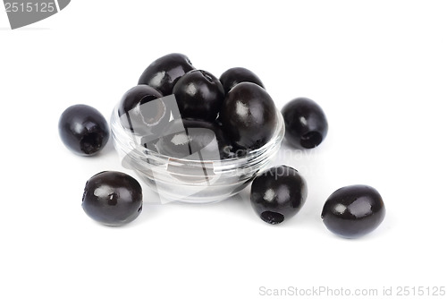 Image of Black pitted olives in glass isolated on white macro 