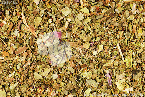 Image of Pile of ground dried Basil (Sweet Basil) as background. Used as a spice in culinary herb all over the world. The plant is also used in medicine. 
