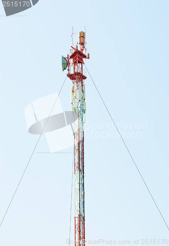 Image of Telecommunications tower with different antenna  on blue sky background   