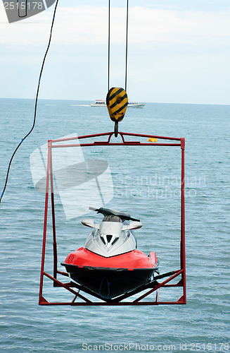 Image of jet ski lift for dry storage   on the sea  background