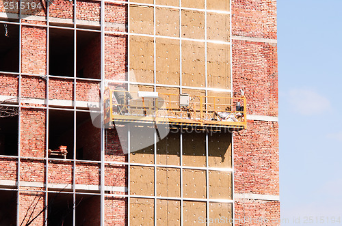 Image of Office building construction site. Thermal insulation of walls