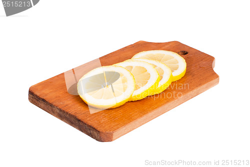 Image of Slices of lemon  on wooden cutting board  isolated on  white
