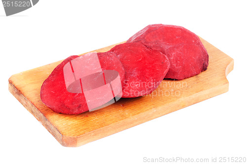 Image of Beet purple vegetable sliced on  cutting board isolated on white background 