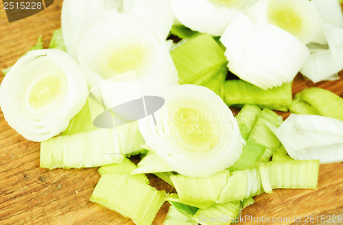 Image of Fresh leek on  cutting board as food background